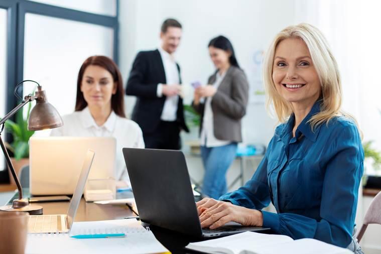 A person sitting at a desk with a computer

AI-generated content may be incorrect.