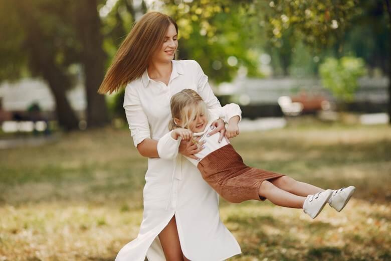 A person holding a child